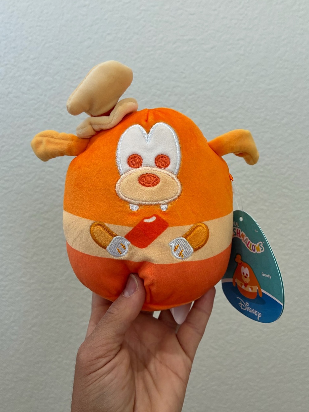 Squishmallows Disney Mystery Squad 
Goofy Orange-scented Popsicle 5”